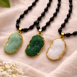 jade pendants on delicate necklaces.webp